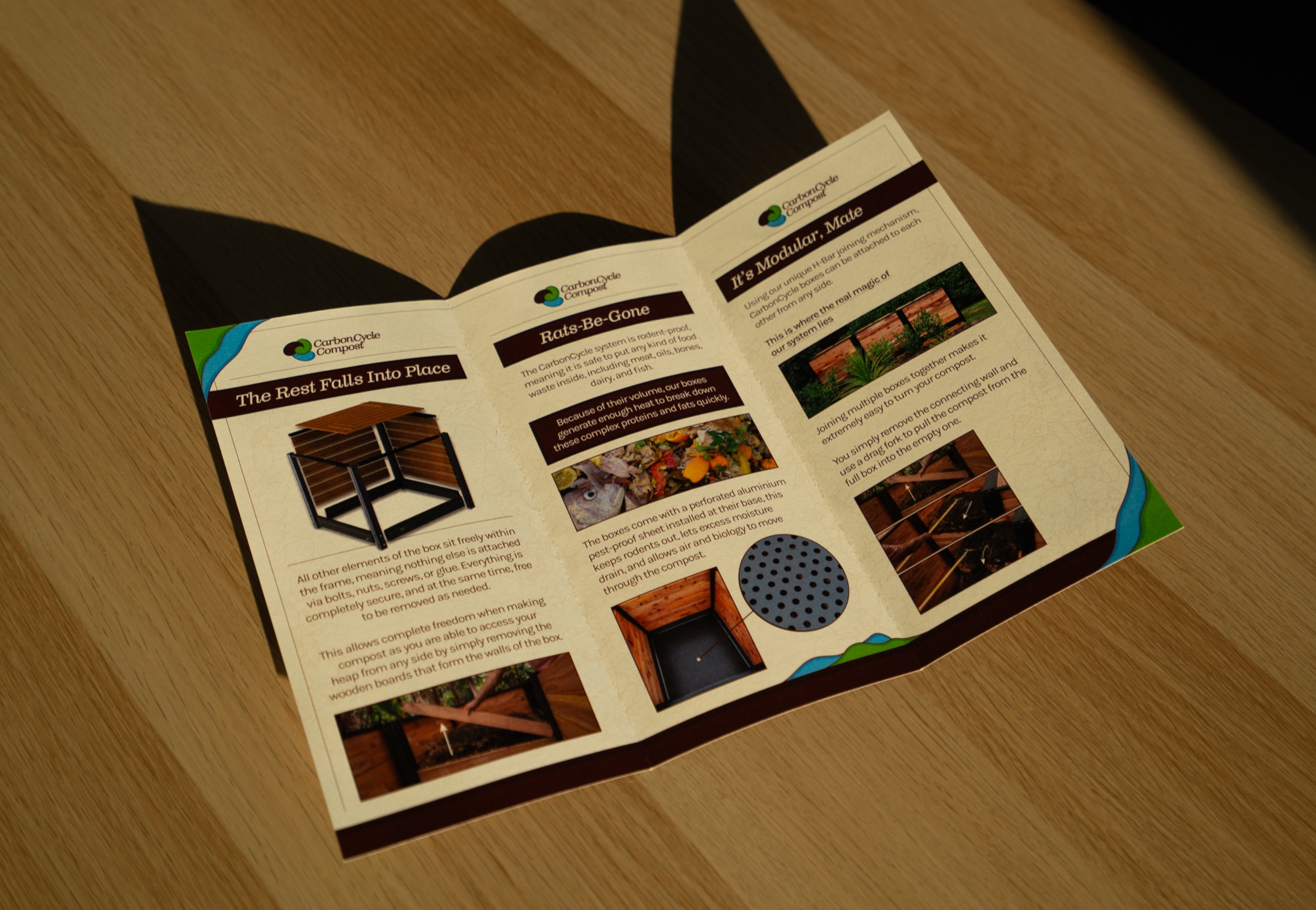 The brochure half open, inside panels in low sunlight